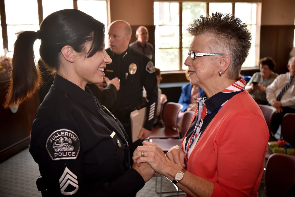 Fullerton PD Sgt. Kathryn Hamel greets Ruth Hatch-Huntzinger, the wife of Officer Jerry Hatch who was killed in 1975 while on duty, at the start of a remembrance gathering at Fullerton PD. Photo by Steven Georges/Behind the Badge OC