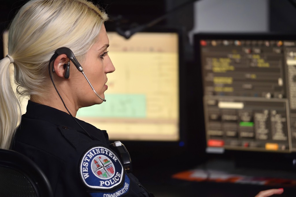 Erica Marlow of the Westminster PD takes calls at the department’s dispatch center. Photo by Steven Georges/Behind the Badge OC