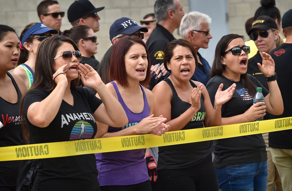 Fellow competitors and friends cheer on the athletes during the OCSD Women’s Fitness Challenge. Photo by Steven Georges/Behind the Badge OC