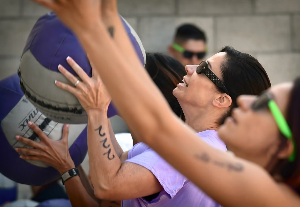 Sgt. Kathryn Hamel of Fullerton PD starts the timed competition bouncing a medicine ball off a wall during the OCSD Women’s Fitness Challenge. Photo by Steven Georges/Behind the Badge OC