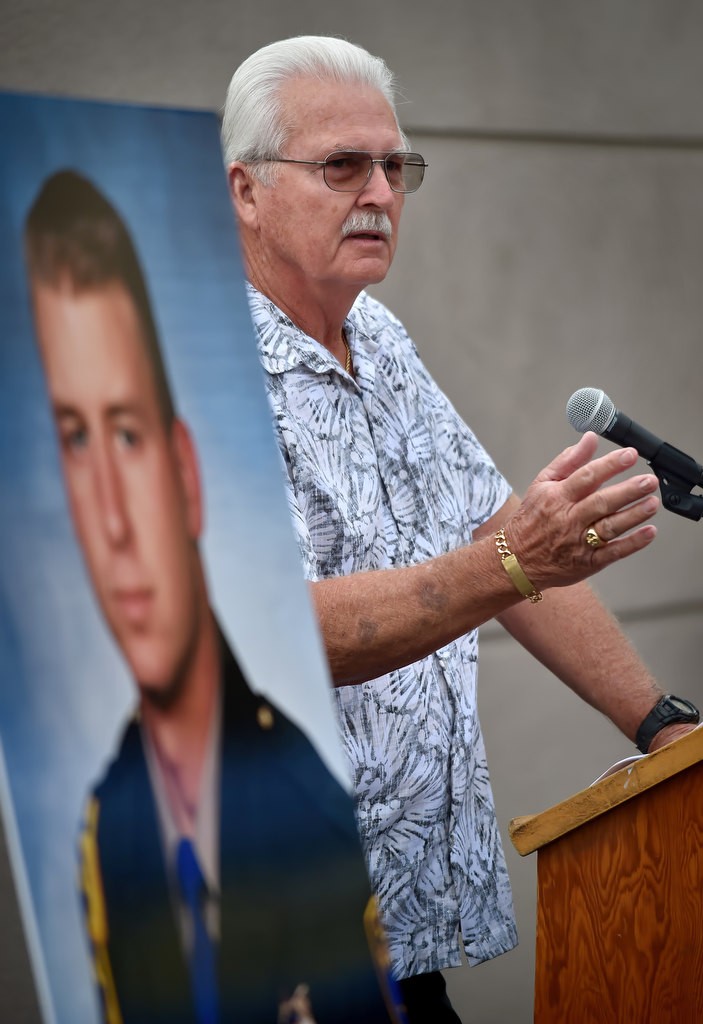 Retired CHP Sgt. Don Burt Sr. remembers his son, CHP officer Don Burt who was murdered 20 years ago in Fullerton (photo left) during a memorial ceremony at the location where he was killed. Photo by Steven Georges/Behind the Badge OC