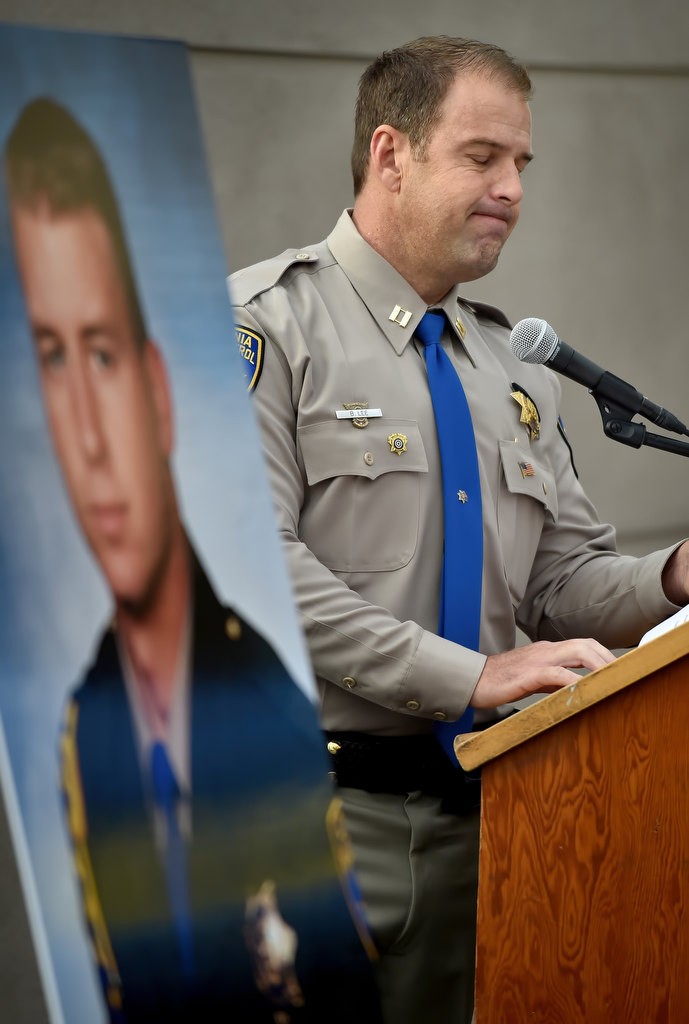 Capt. Brian Lee of the CHP Westminster Area office remembers fallen CHP Officer Don Burt, photo at left, during the 20th anniversary memorial remembrance ceremony. Photo by Steven Georges/Behind the Badge OC