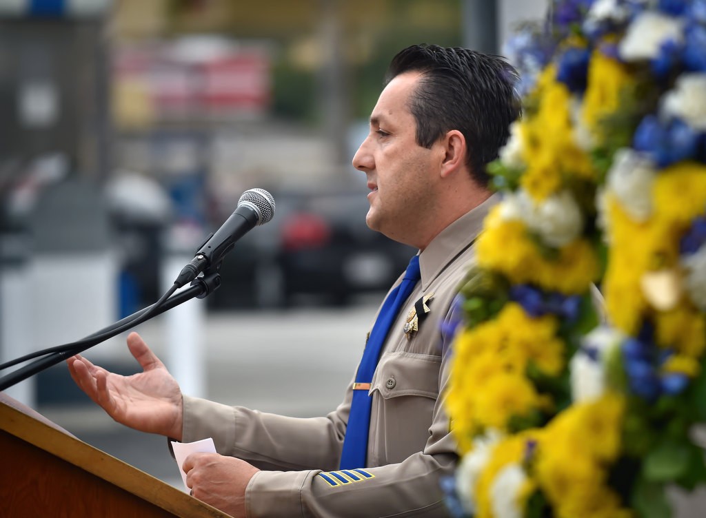 CHP Sgt. Aaron Knarr of the Santa Ana office talks about his friend and colleague Officer Don Burt during a remembrance ceremony. Photo by Steven Georges/Behind the Badge OC