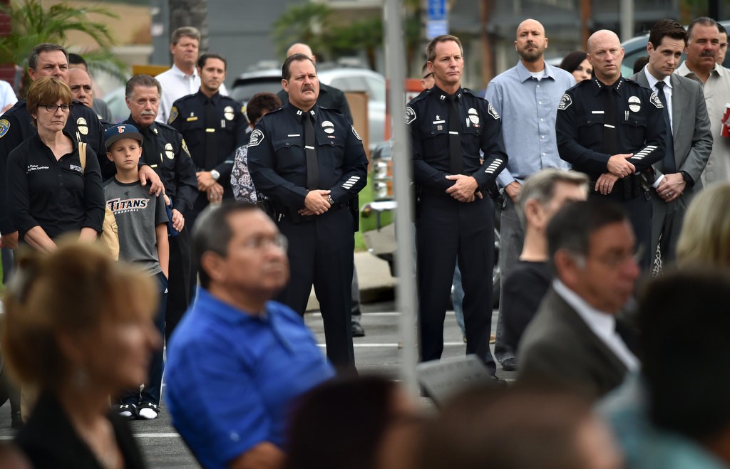 CHP officers stand with Fullerton PD personal, including Capt. Scott Rudisil, Capt. John Siko and Chief Dan Hughes, right, during the CHP Officer Don Burt remembrance ceremony. Photo by Steven Georges/Behind the Badge OC