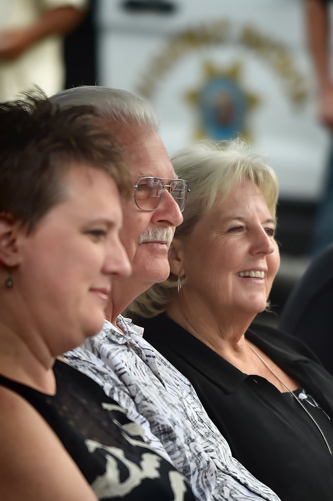 Kristin Burt-Cooper, wife of CHP officer Don Burt who was murdered 20 years ago, left, sits with Don’s father Retired CHP Sgt. Don Burt Sr., and his wife Donna during a remembrance ceremony. Photo by Steven Georges/Behind the Badge OC