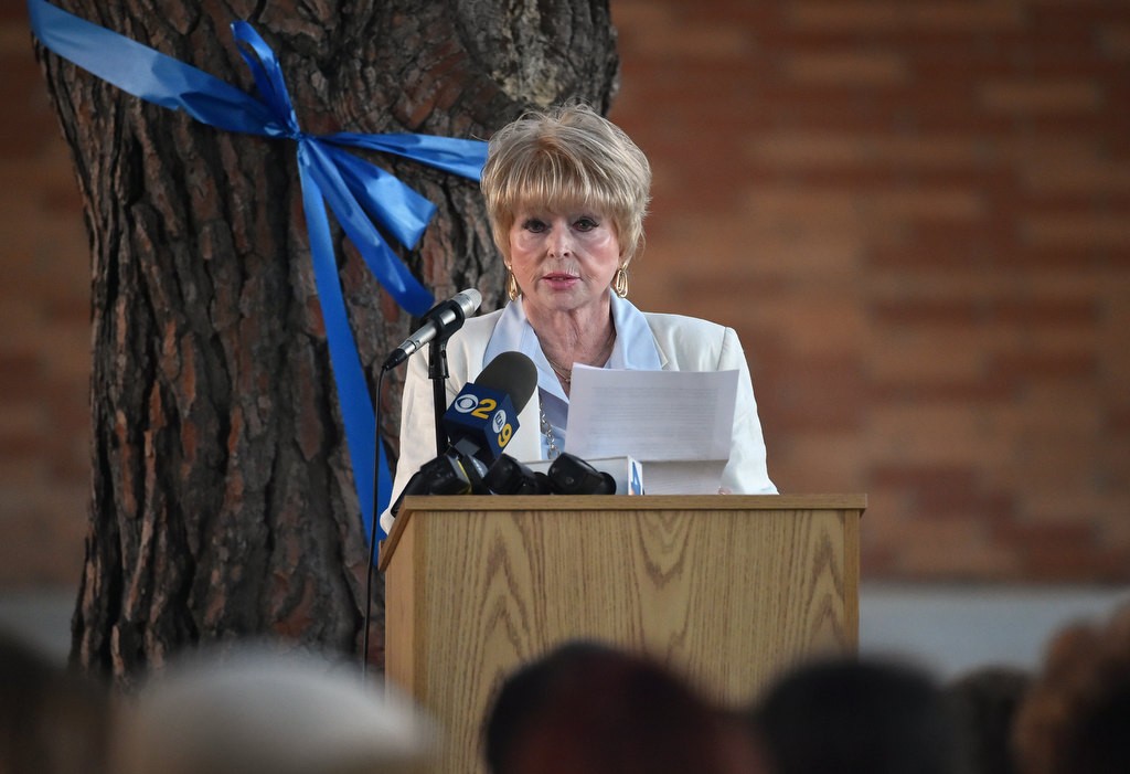 Pat Almazan, daughter of Frank Teplansky who was killed in the 1976 CSUF shootings, talks about her father during the the 40th anniversary remembrance ceremony at Memorial Grove. Photo by Steven Georges/Behind the Badge OC