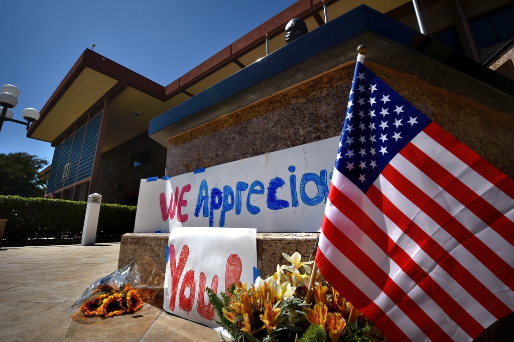 A “We Appreciate You!” banner and flowers were left at the base of the Garden Grove Police memorial. Photo by Steven Georges/Behind the Badge OC