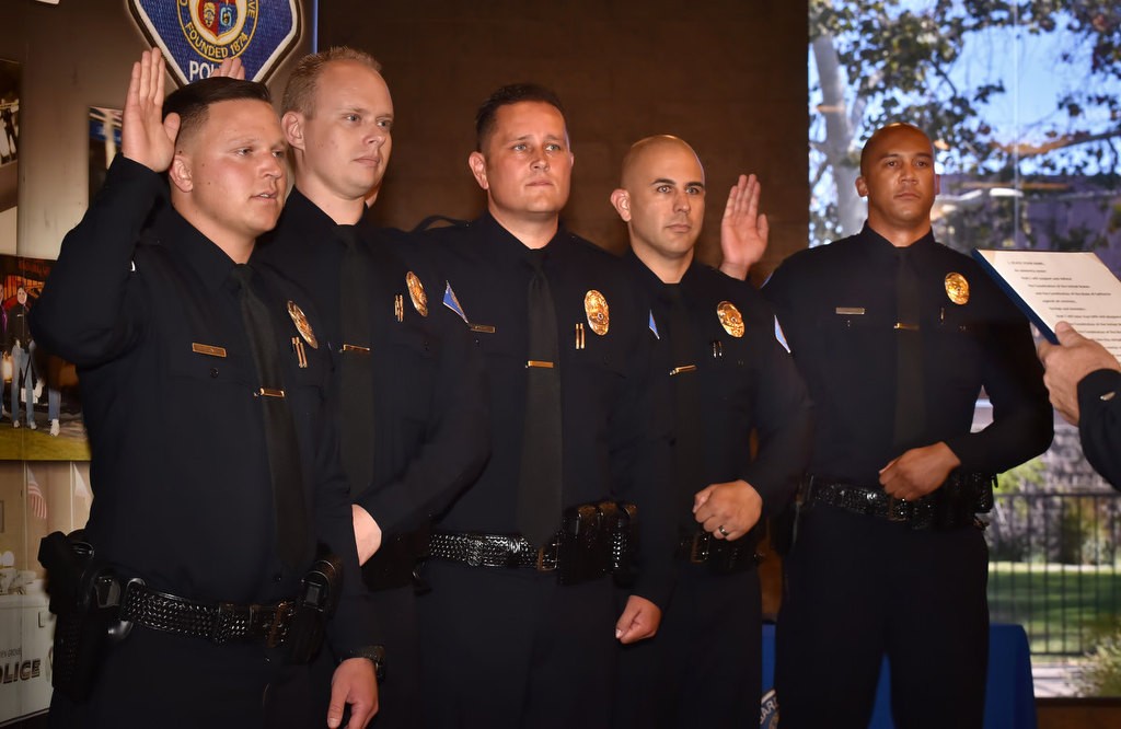 Five, from left, being sworn in as Garden Grove’s newest officers are Hunter King,Timothy Ashbaugh, Gary “Dustin” Staal, Arion “A.J.” Knight and Jerome Cheatham. Photo by Steven Georges/Behind the Badge OC
