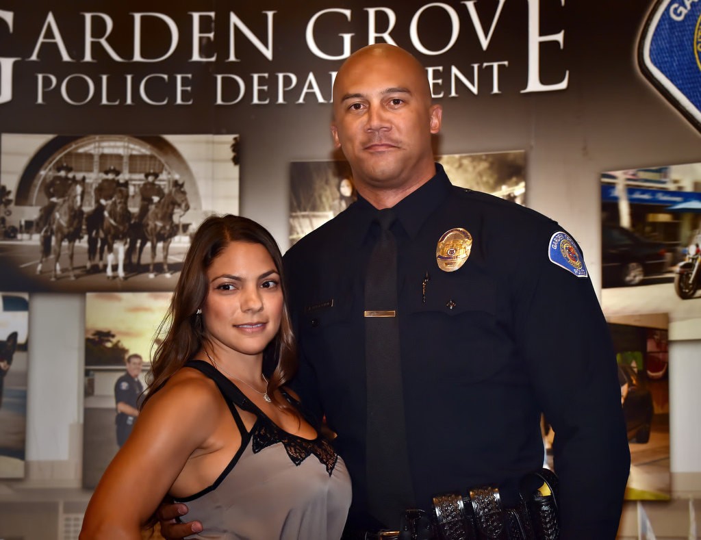 Jerome Cheatham, formerly Fountain Valley PD, Torrance PD as well as US Army deployed to Afghanistan and Iraq, receives his new badge as a Garden Grove PD officer. Photo by Steven Georges/Behind the Badge OC
