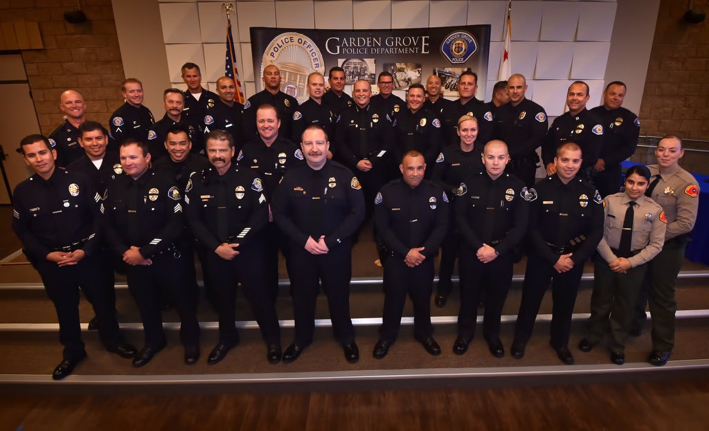 All officers attending the Garden Grove swearing in ceremony at the Garden Grove Community Meeting Center, gather at the front of the stage. Photo by Steven Georges/Behind the Badge OC