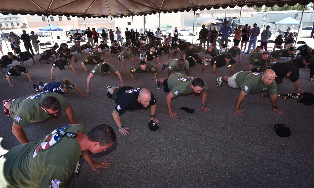 OC Sheriff deputies perform the final twenty two pushups after completing 22 pushups each hour for the past 22 hours at the Theo Lacy Facility to raise awareness for the 22 veterans who, on average, commit suicide each day. Photo by Steven Georges/Behind the Badge OC