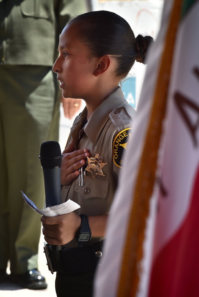 OC Sheriff Explore Aleah Lopez, 11, leads the Pledge of Allegiance during the Push 22 ceremony. Lopez, who has been an explorer for about a year, said she was inspired to become an explorer by her sister who is a CSA (Correctional Services Assistant) with the OCSD. Photo by Steven Georges/Behind the Badge OC