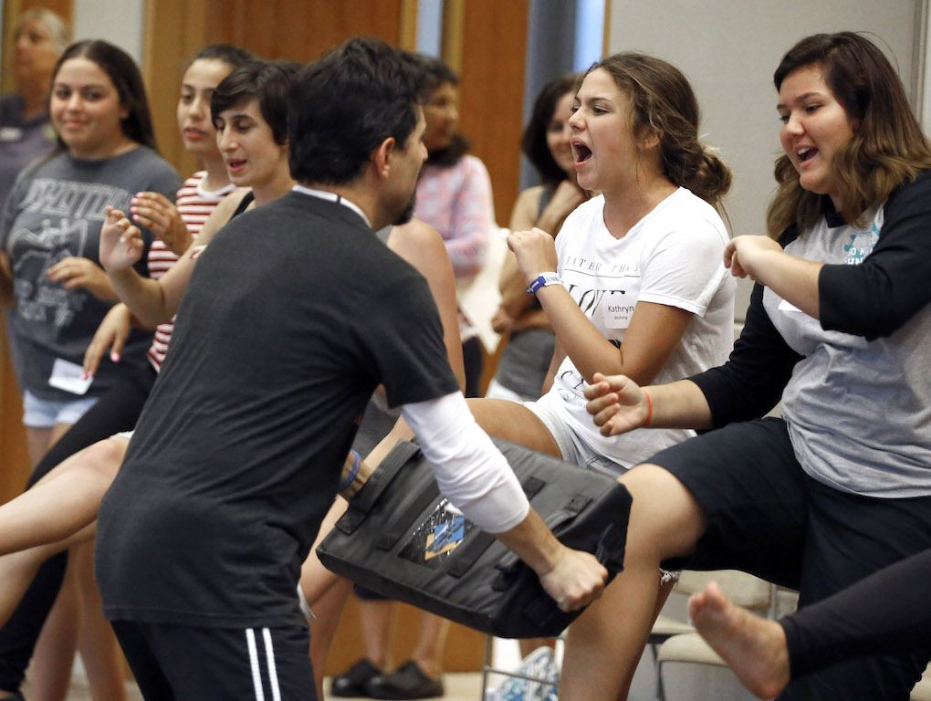 College and high school students learn techniques to fight off attackers during a female empowerment initiative safety session at Laguna Niguel City Hall. Photo by Christine Cotter/Behind the Badge OC 
