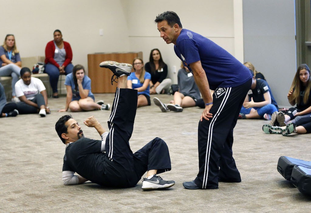 GET SAFE instructors Dave Monderine and Stuart Haskin demonstrate self-defense techniques during a safety class for young women and teens at Laguna Niguel City Hall.  Photo by Christine Cotter/Behind the Badge OC