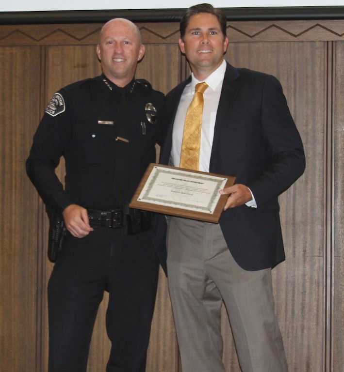 FPD Chief Dan Hughes presents the Chief's Commendation to Rob Von Esch. Photo courtesy of the Fullerton Police Department