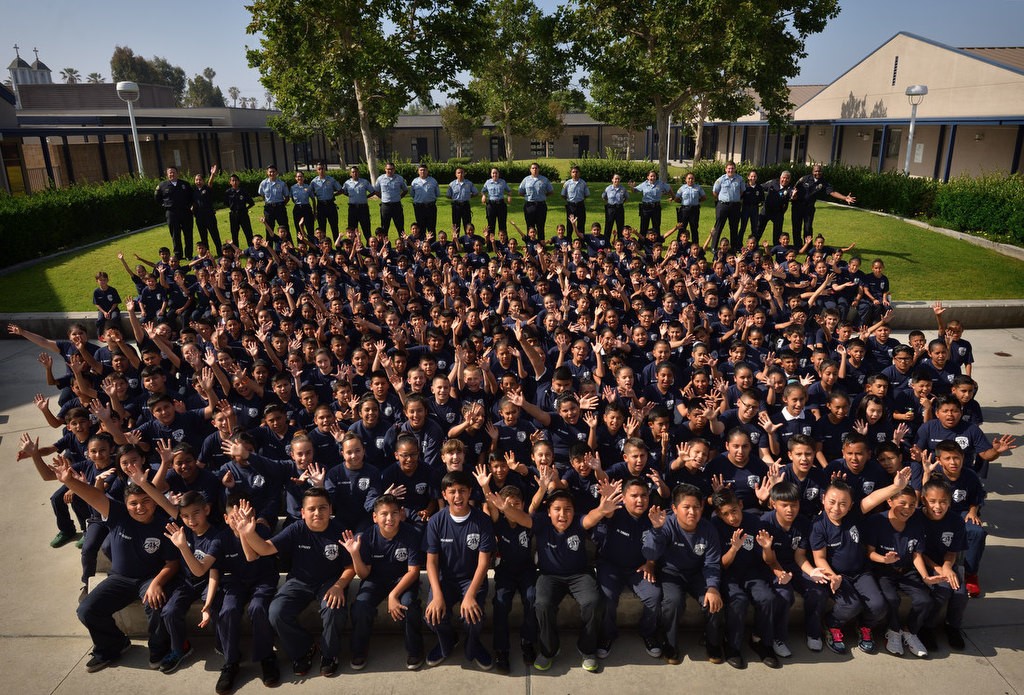 The 2016 Anaheim PD Cops 4 Kids Jr. Cadet Academy at Betsy Ross Elementary. Light blue shirts in back row are Explorers. Photo by Steven Georges/Behind the Badge OC