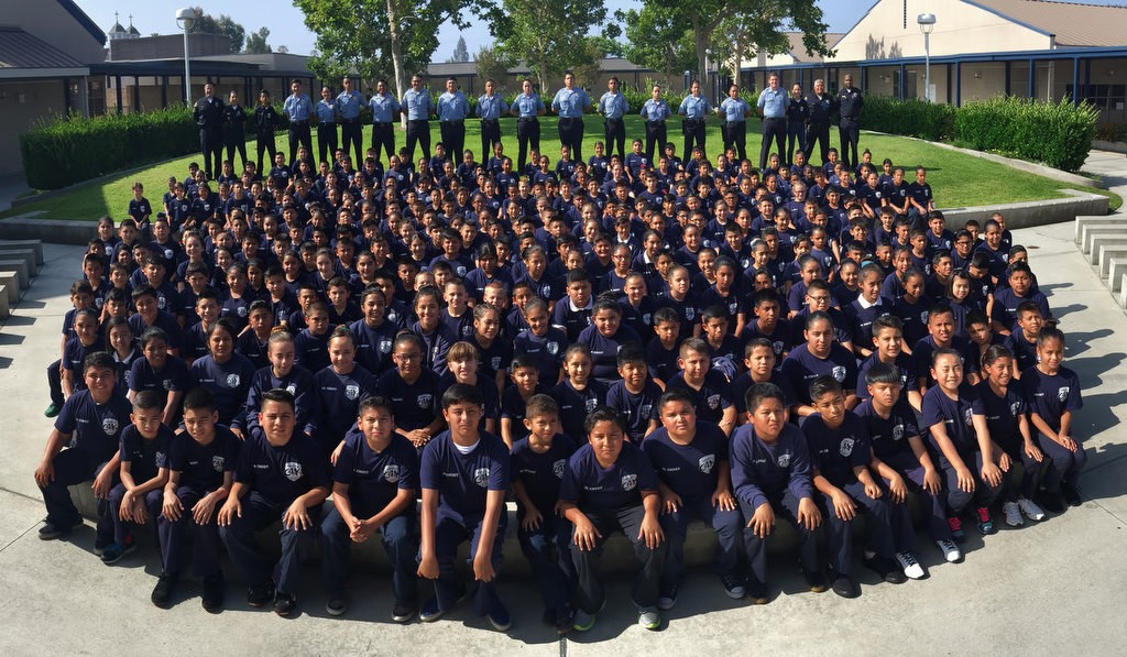 The 2016 Anaheim PD Cops 4 Kids Jr. Cadet Academy at Betsy Ross Elementary. Light blue shirts in back row are Explorers. Photo by Steven Georges/Behind the Badge OC