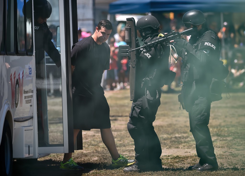West County SWAT members extract a pretend bad guy during a hostage demonstration at Sigler Park, part of Westminster’s annual Public Awareness Safety Day. Photo by Steven Georges/Behind the Badge OC