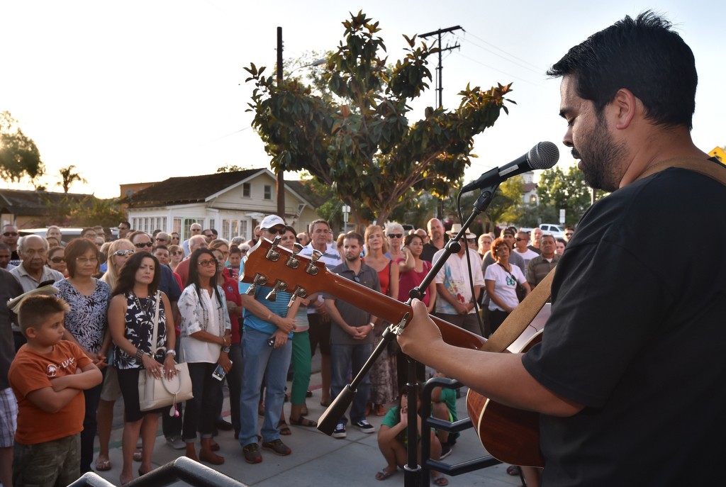 Mead Chesebro of Calvary Chapel in La Habra sings inspirational songs as community members and religious leaders gather at the steps of La Habra PD to pray for officers who serve the city. Photo by Steven Georges/Behind the Badge OC