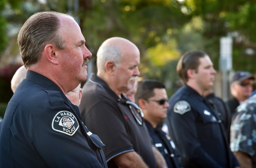La Habra Capt. Jeff Swaim, left, listens to religious leaders during a community gathering as they talk about how much the men and women of the police department are appreciated. Photo by Steven Georges/Behind the Badge OC
