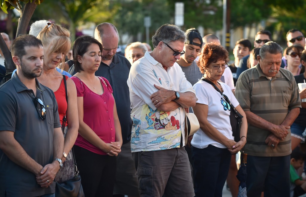 Community members bow their heads as they prayed in front of the La Habra PD for the officers who serve the city. Photo by Steven Georges/Behind the Badge OC