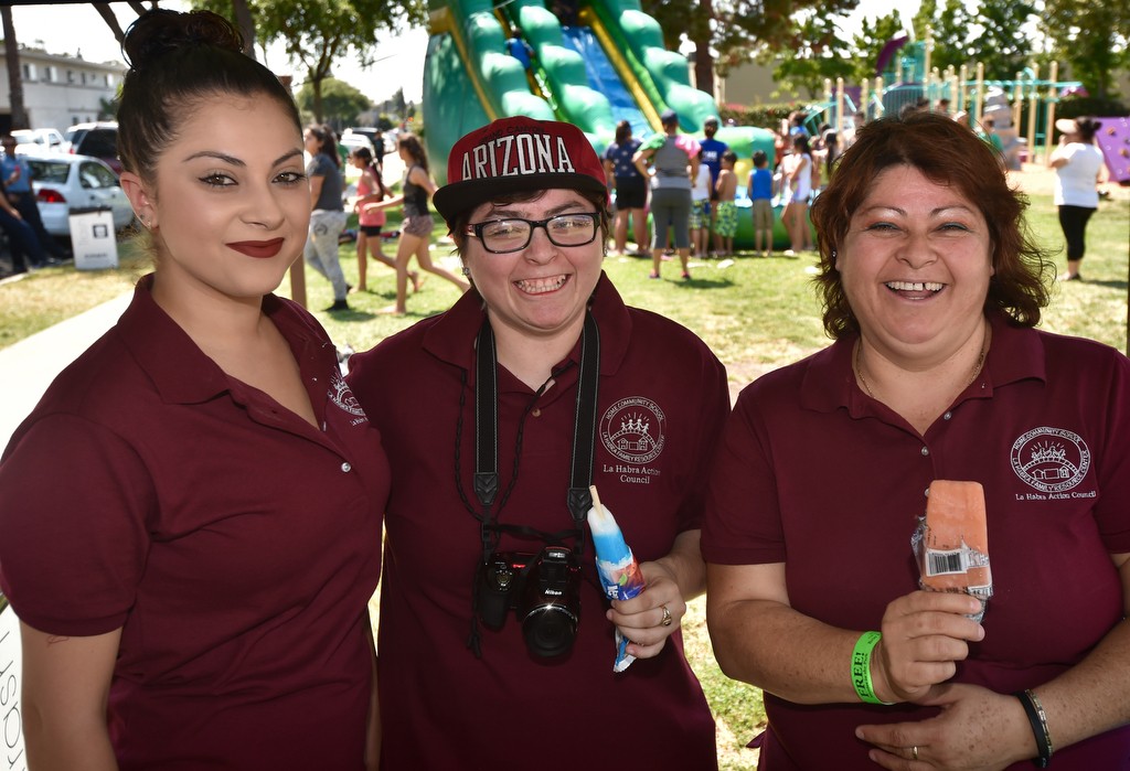 Cristina Nunez, left, her sister Adriana Nunez and Norma Perez of the La Habra Action Council at Montwood Park during the Cool Cops community outreach gathering. Photo by Steven Georges/Behind the Badge OC