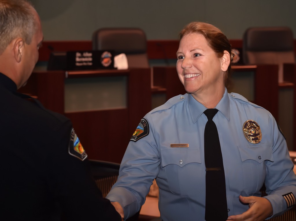 Tustin Civilian Police Commander Katarina Thomas is greeted by Tustin Police Chief Charles Celano during a promotions and swearing in ceremony. Photo by Steven Georges/Behind the Badge OC