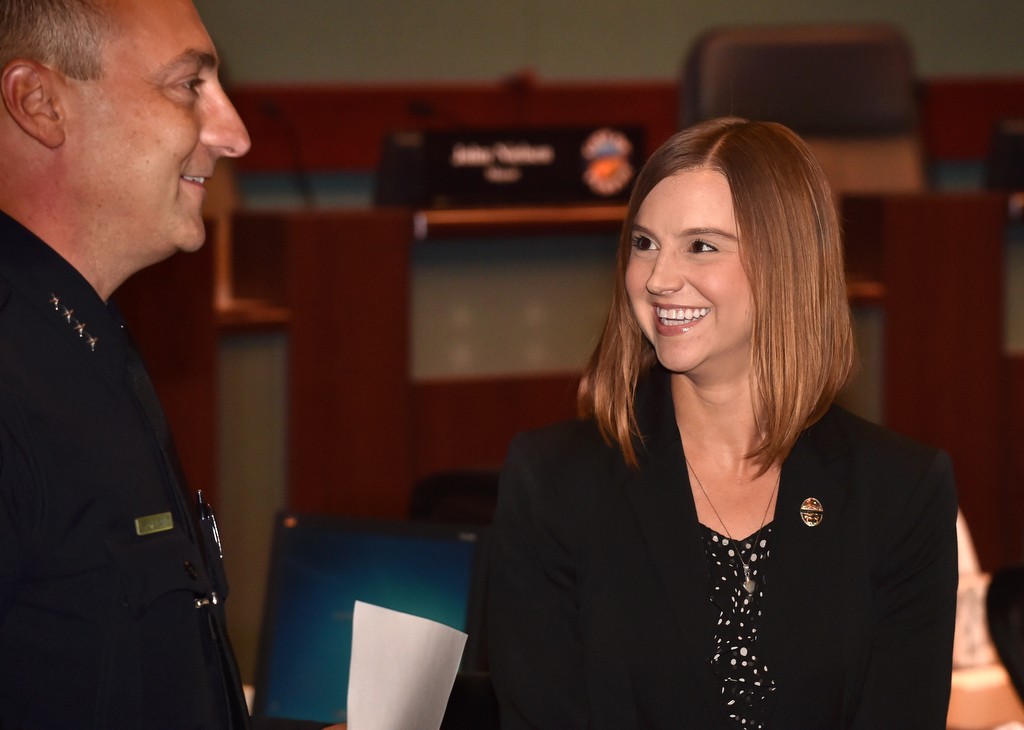 Tustin PD Management Assistant Melissa Laird is greeted by Tustin Police Chief Charles Celano during a promotions ceremony. Photo by Steven Georges/Behind the Badge OC