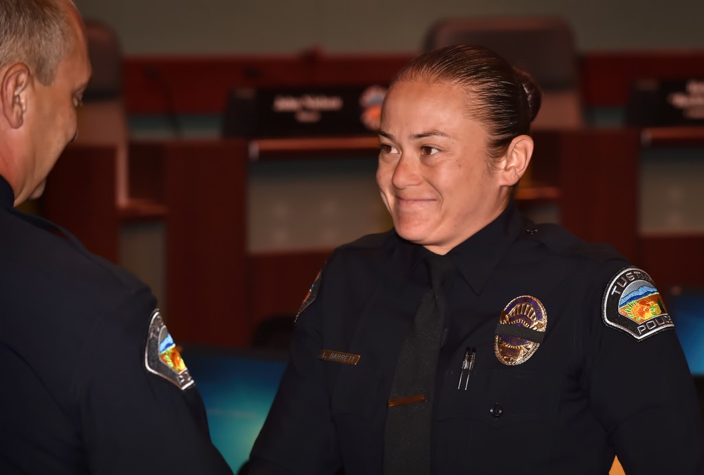 Tustin PD Officer Leah Barrett is greeted by Tustin Police Chief Charles Celano during a promotions and swearing in ceremony. Photo by Steven Georges/Behind the Badge OC
