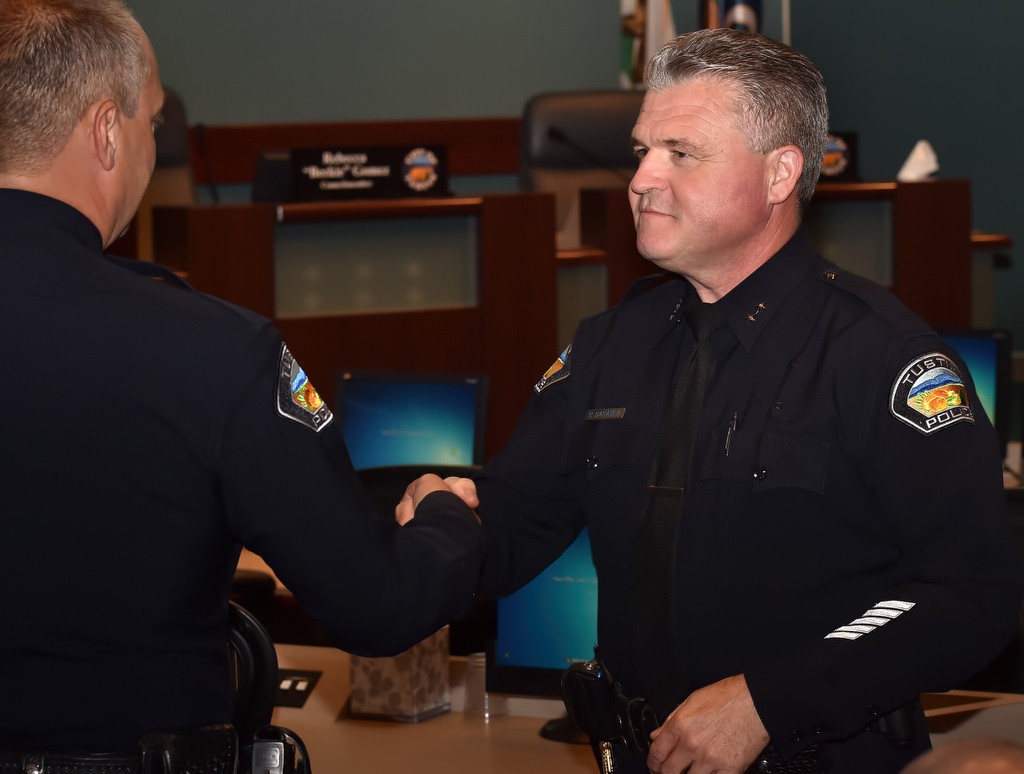 Tustin PD’s new Deputy Chief Paul Garaven, right, is greeted by Chief Charles Celano during a promotions and swearing in ceremony. Photo by Steven Georges/Behind the Badge OC