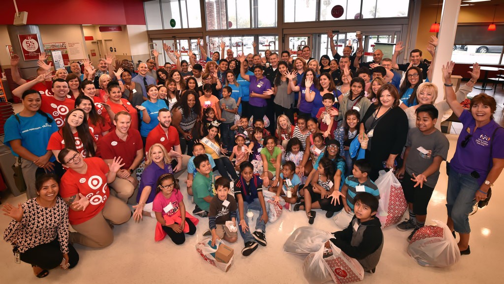 Kids from OCFJC Foundation’s sixth annual Back-to-School Program, the Anaheim PD, OCFJC members, Target employees and volunteers gather for a group photo at the conclusion of a back to school shopping spree at the Target in Anaheim. Photo by Steven Georges/Behind the Badge OC