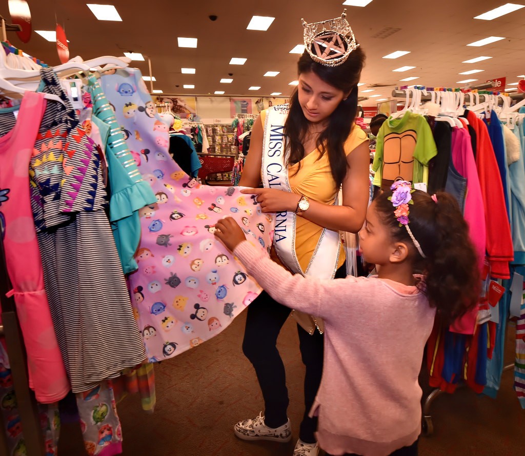 Five-year-old London gets help picking out a dress from Jessa Carmack, Miss California 2016, during a back to school shopping spree at Target. Photo by Steven Georges/Behind the Badge OC