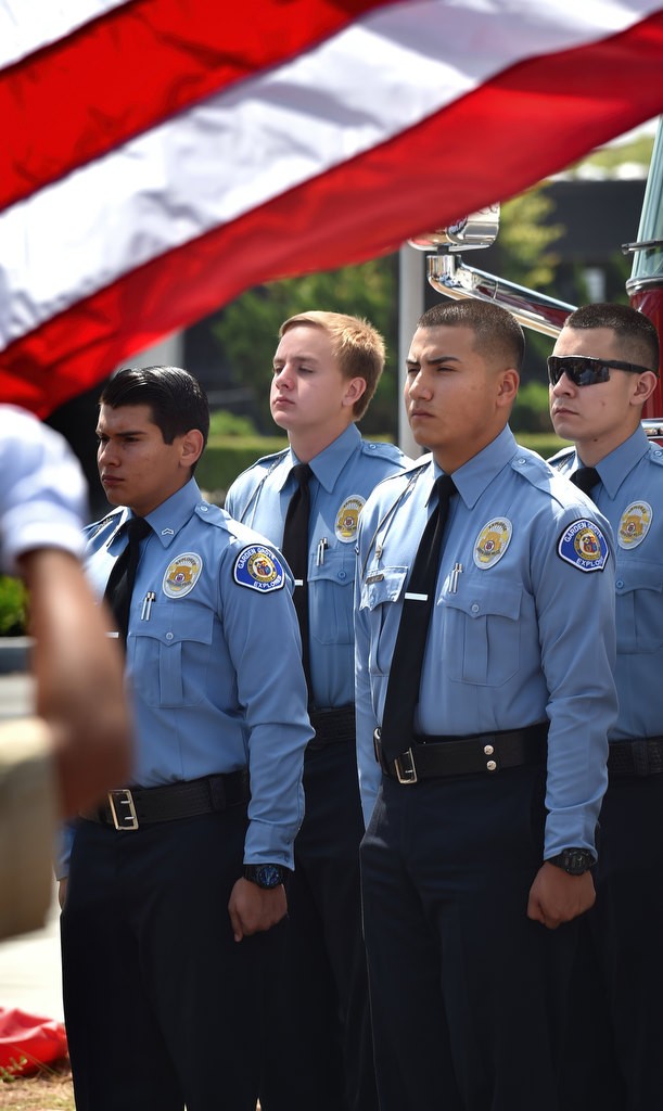 Garden Grove PD Explorers stand at attention as Boy Scouts perform the morning flag raising ceremony for the grand re-opening of the Valley View McDonald’s. Photo by Steven Georges/Behind the Badge OC