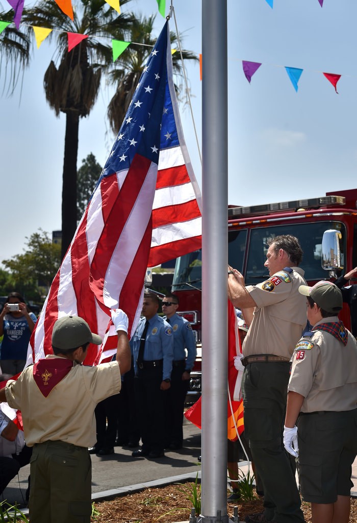 Boy Scouts from local troop 75 perform the morning flag raising ceremony for the grand re-opening of the Valley View McDonald’s. Photo by Steven Georges/Behind the Badge OC