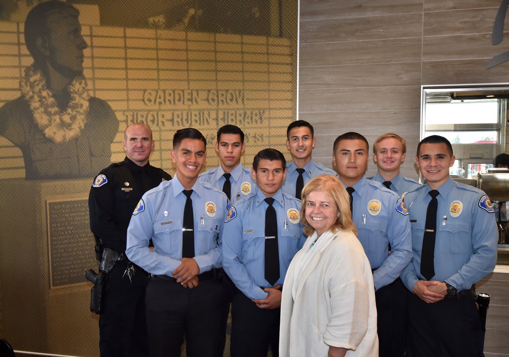 Local McDonald’s Owner/Operator Patti Widdecombe, center stands with Garden Grove Explorers and Officer Brian Hatfield, left, after Widdecombe presented the Garden Grove PD Explorers for $500. Photo by Steven Georges/Behind the Badge OC