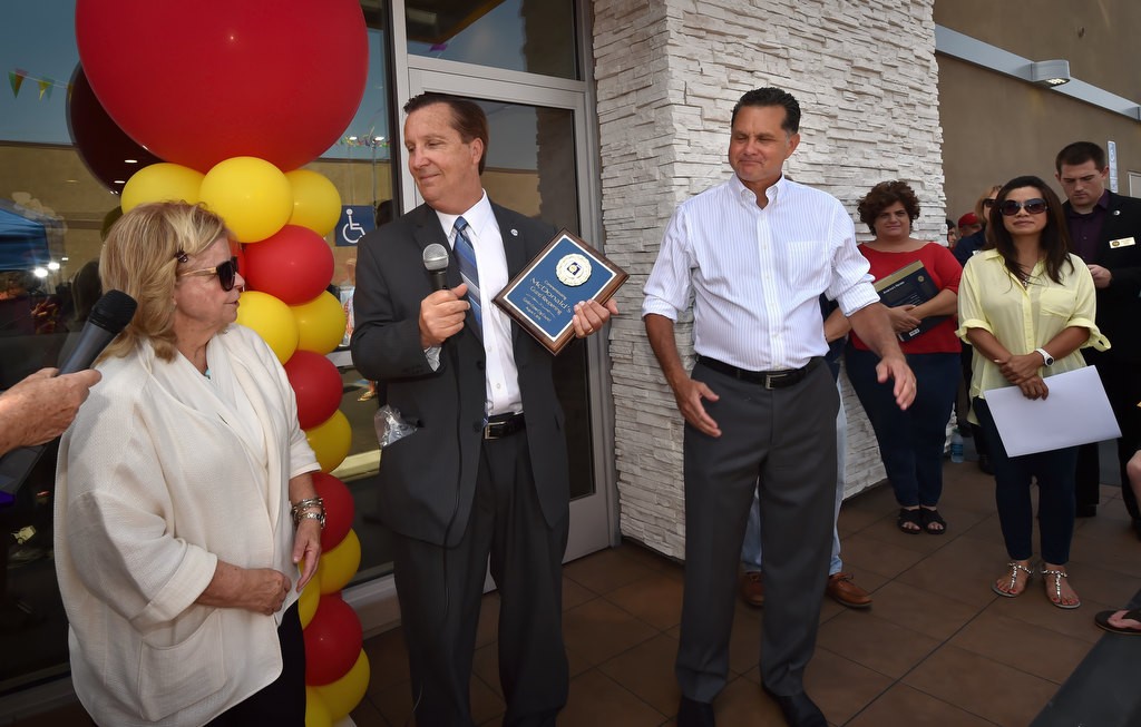 Garden Grove City Council Member Kris Beard, center, and City Manager Scott Stiles, right, helps celebrate the grand re-opening of the Valley View McDonald’s with owner/operator Patti Widdicombe, right. Photo by Steven Georges/Behind the Badge OC