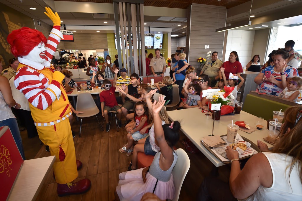 Ronald McDonald entertains kids with a magic show during the grand re-opening of the rebuilt McDonald’s on Valley View St. Photo by Steven Georges/Behind the Badge OC