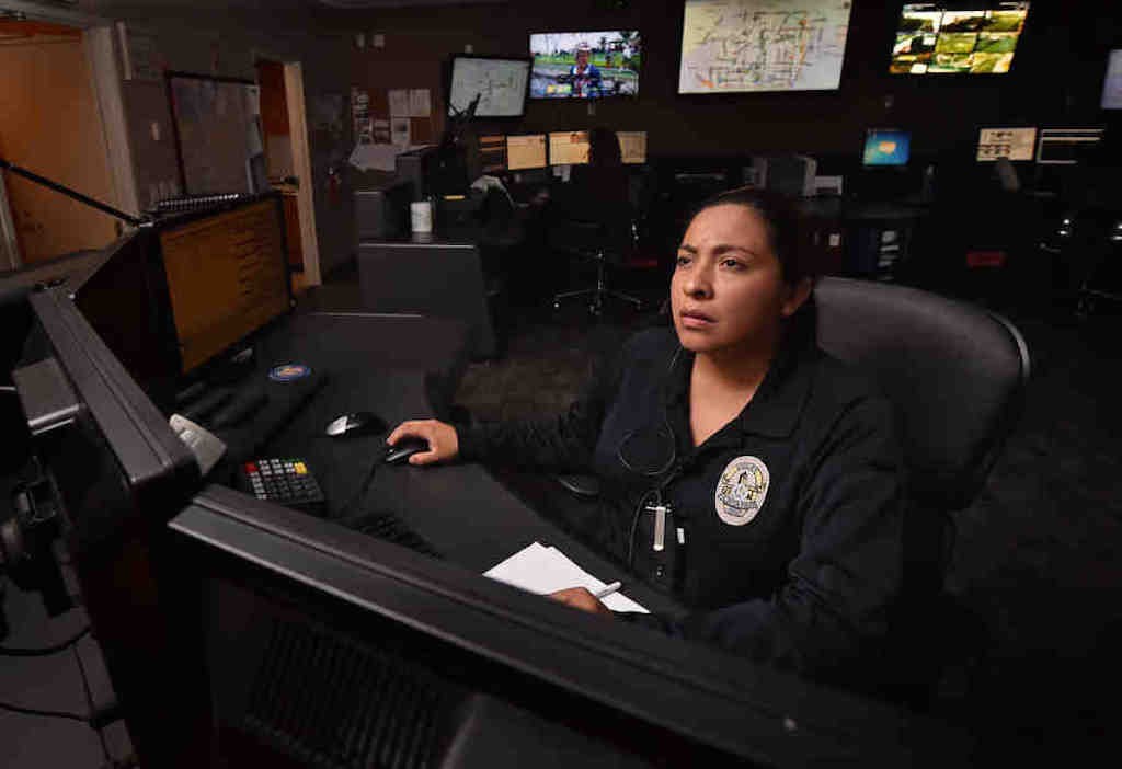 Fullerton PD Dispatcher Finn takes calls from the public at the dispatch center. Photo by Steven Georges/Behind the Badge OC