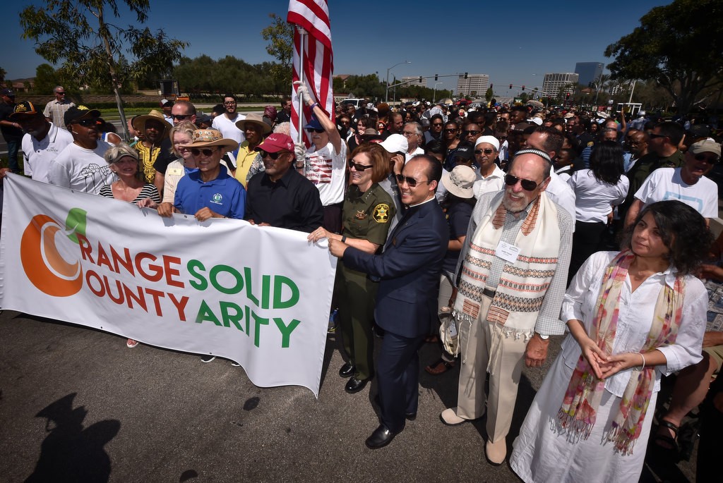 The public along with police and church groups get ready to walk down Irvine Center Dr. in a solidarity march. Photo by Steven Georges/Behind the Badge OC