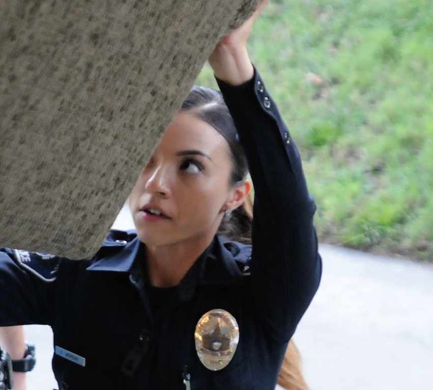  Buena Park Police Officer Kristine Munoz does her part during a volunteer effort involving officers and Explorers, who moved furniture to relocate the victims of a burglary into a new second-floor apartment. Photo by Lou Ponsi/Behind the Badge OC 