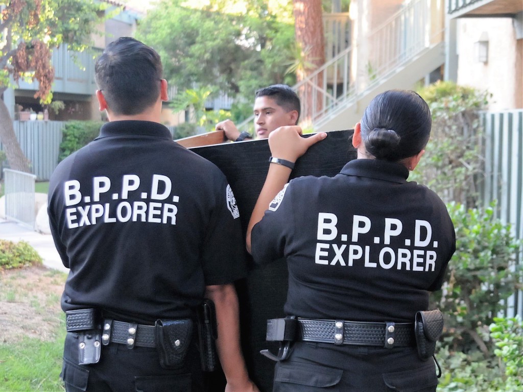 Buena Park police officers and Explorers volunteered their time to relocate a group of female college students into a second-floor apartment after their first-floor unit was burglarized. Photo by Lou Ponsi/Behind the Badge OC  