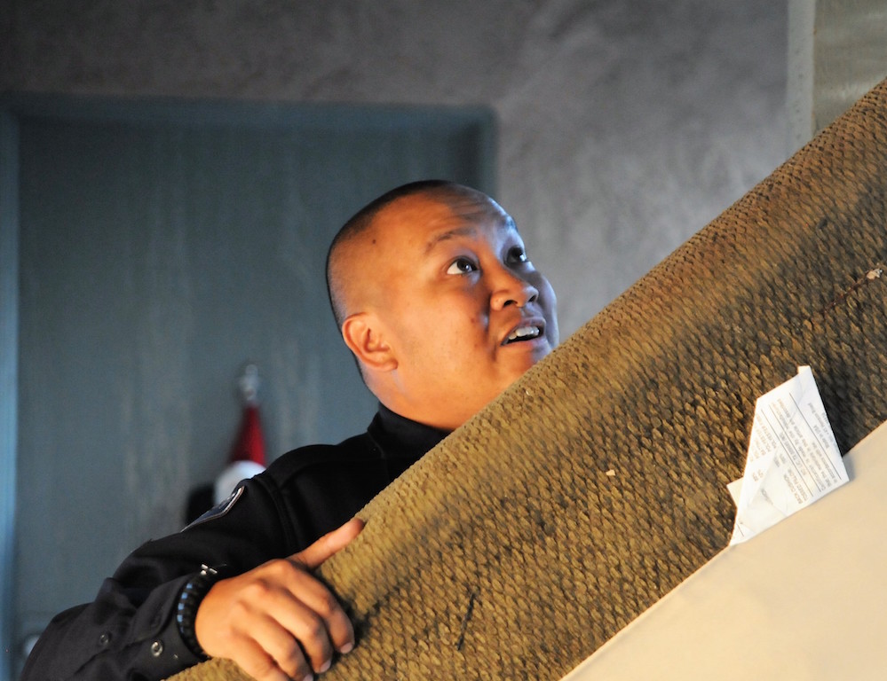 Buena Park Police Officer Jeff Vu as among a group of Explorers and officers who moved a group of female college students from a downstairs apartment to an upstairs unit, following a burglary. Photo by Lou Ponsi/Behind the Badge OC 