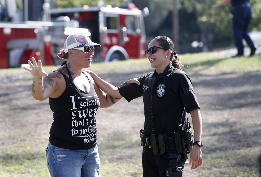 Fullerton PD's  Gabby Soto greets Fullerton resident Sarah Blake during National Night Out at Independence Park. Photo by Christine Cotter