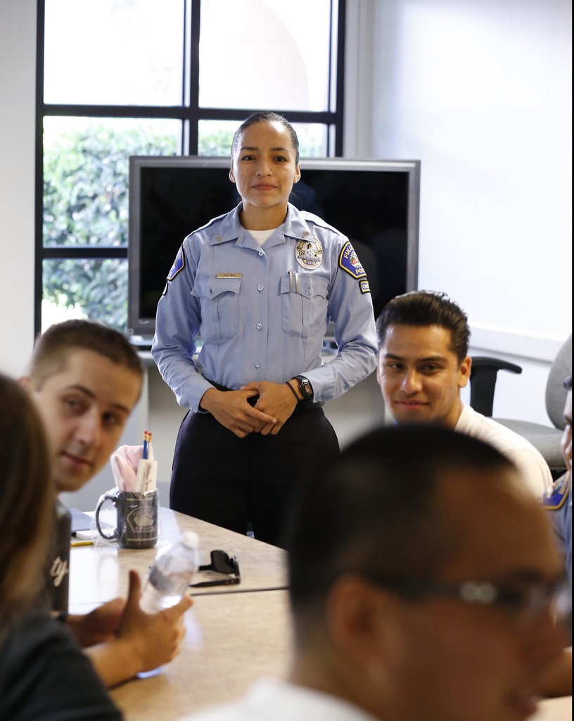 Denise Bueno leads a meeting of fellow cadets at the Fullerton Police Department. Photo by Christine Cotter