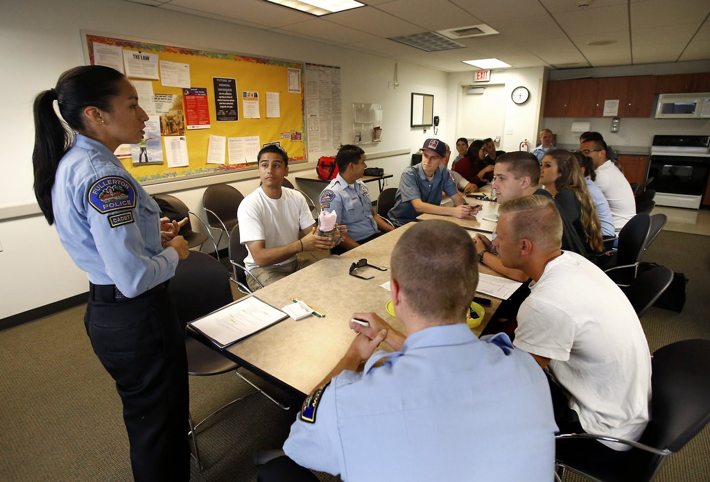 Denise Bueno leads a meeting with a group of fellow Fullerton Police Cadets. Photo by Christine Cotter