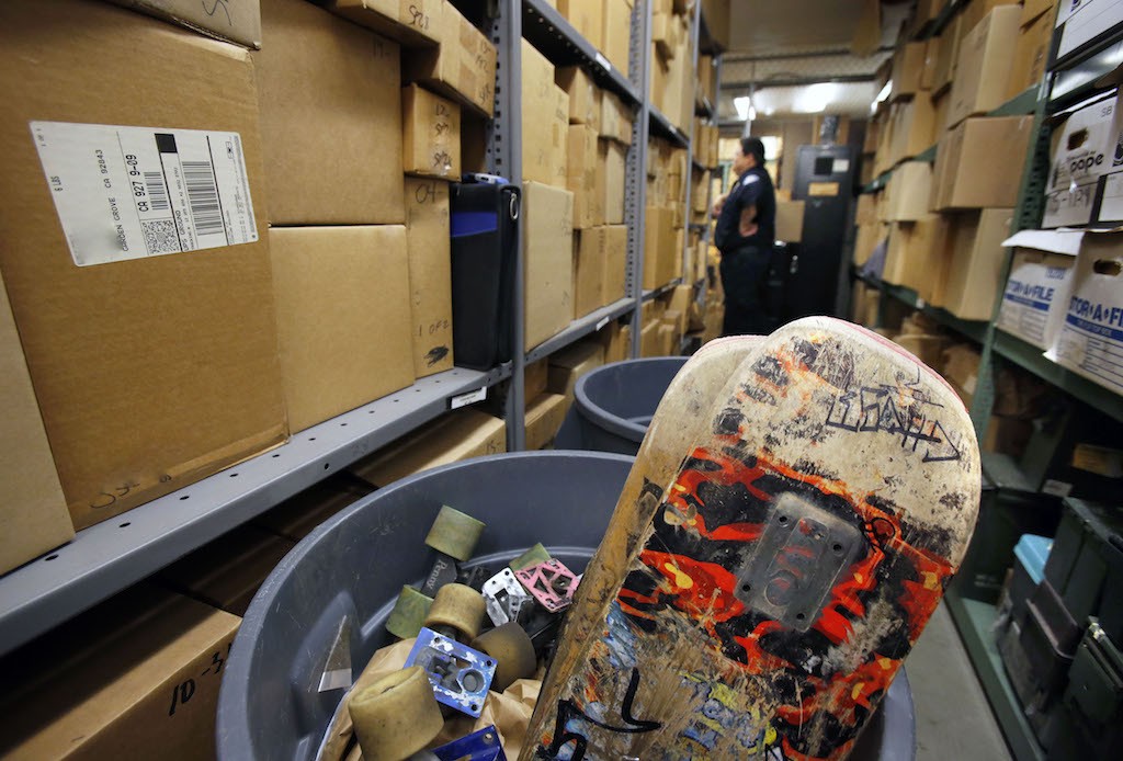 A trash barrel full of skateboards at the Garden Grove PD's evidence storage locker. Photo by Christine Cotter