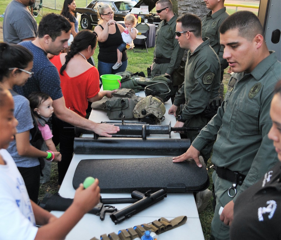 Members of North County SWAT displayed some of their weaponry during National  Night Out festivities. Photo by Lou Ponsi/Behind the Badge OC  