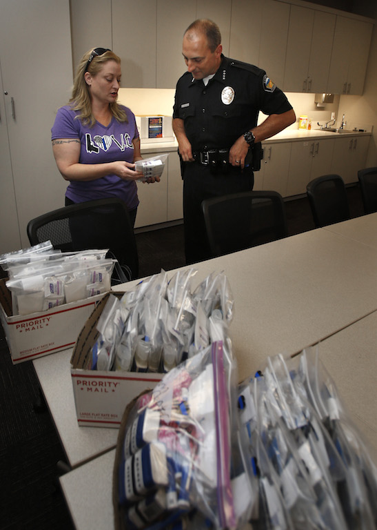 Valerie Mann shows her appreciation and support to Police Chief Charlie Celano by donating bags of snacks, tissues, hygiene products etc. for Tustin Police Department officers. Photo by Christine Cotter/Behind the Badge OC 