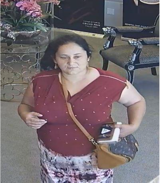 Tustin police are asking for the public's help to find this woman, who is suspected of being part of a distraction scheme to steal a men's watch. Photo courtesy Tustin PD. 