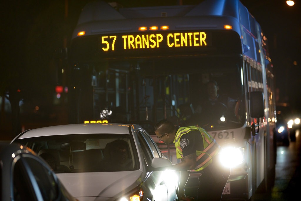 Detective Ricky Reynoso speaks with a driver during the DUI Checkpoint. Photo by Steven Georges/Behind the Badge OC